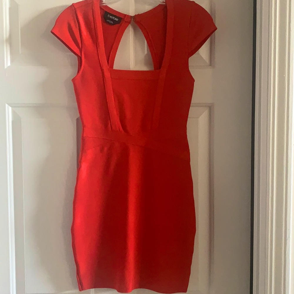 Never worn mini bandage dress in a beautiful burnt orange color! 💃